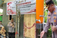 Kapolres Bolmut AKBP Juleigtin Siahaan meresmikan program bedah rumah dan sarana air bersih bagi warga di Bolangitang Barat dan Pinogaluman, Rabu.(Foto: dok*)